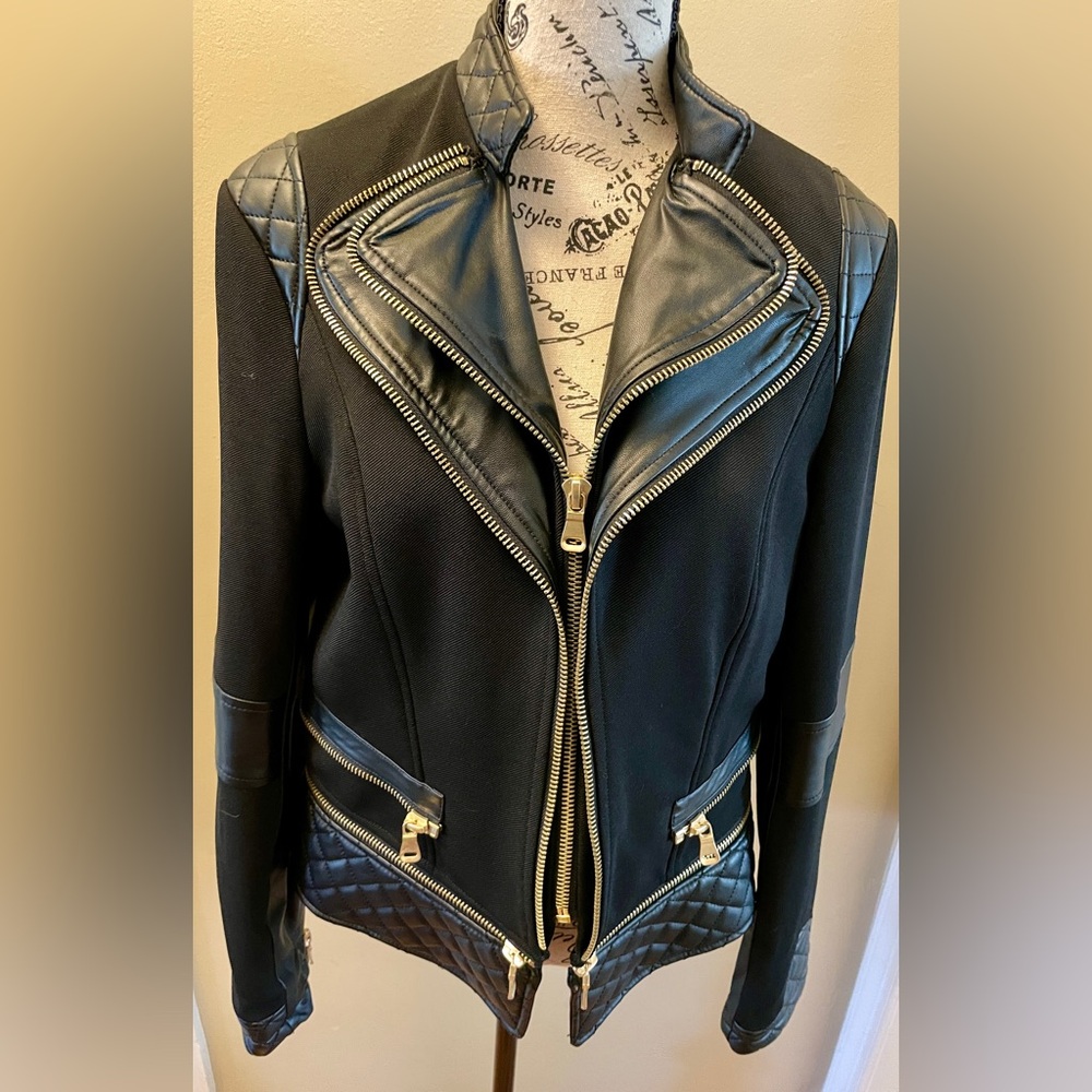 EUC Black motorcycle style jacket with faux black leather trim and gold zippers.